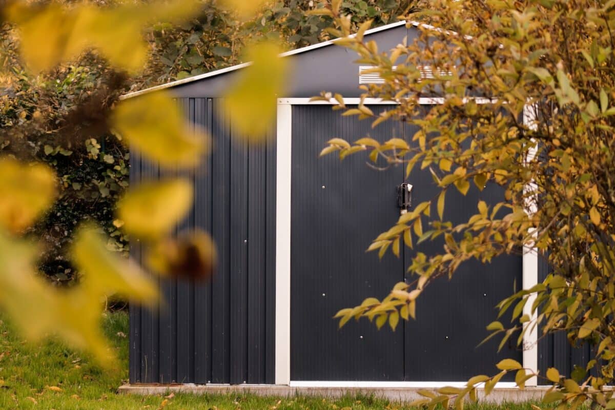 a small shed with a door and a window